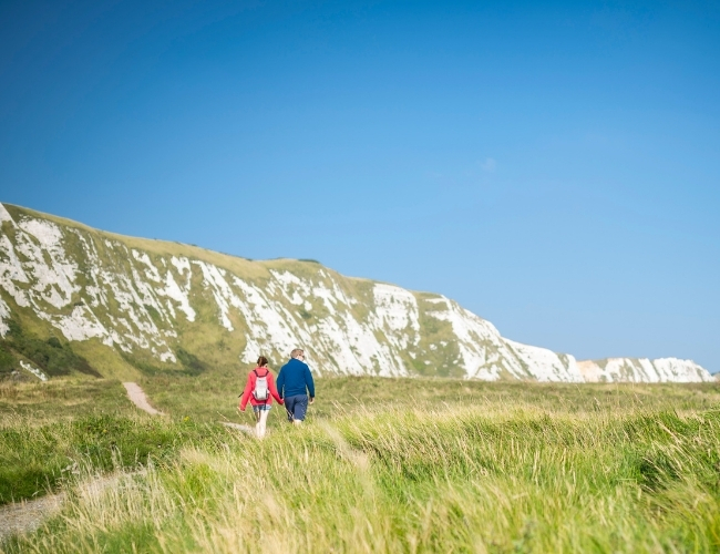 Couple walking along Samphire Hoe, White Cliffs Country, credit Explore Kent